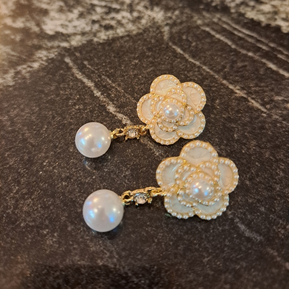 Flower earrings with dangling white pearl like beads